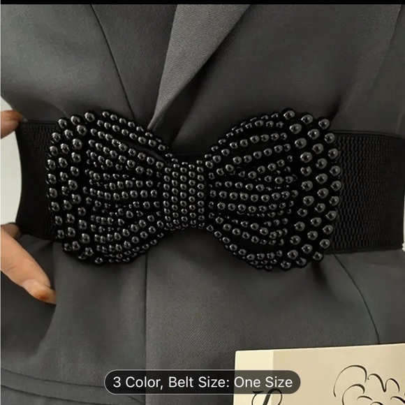 An elegant solid colored elastic waistband with a wide imitation pearl bow - Picture 2 of 10